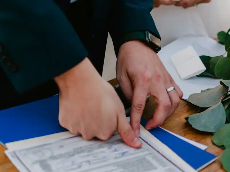 Couple signing a marriage certificate